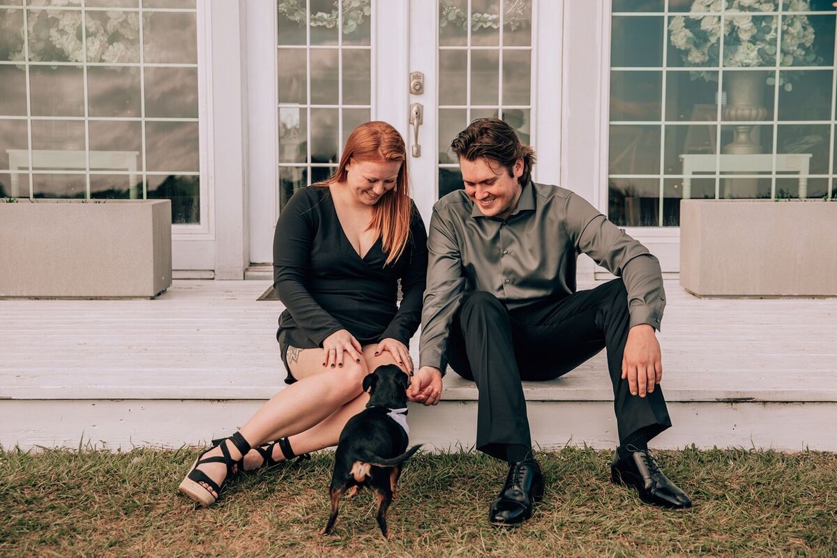 couple take engagement photo with their beloved dog