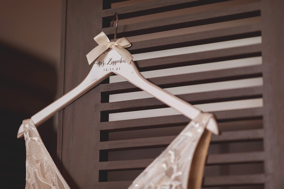 close up of hanger of wedding dress in Riviera Maya