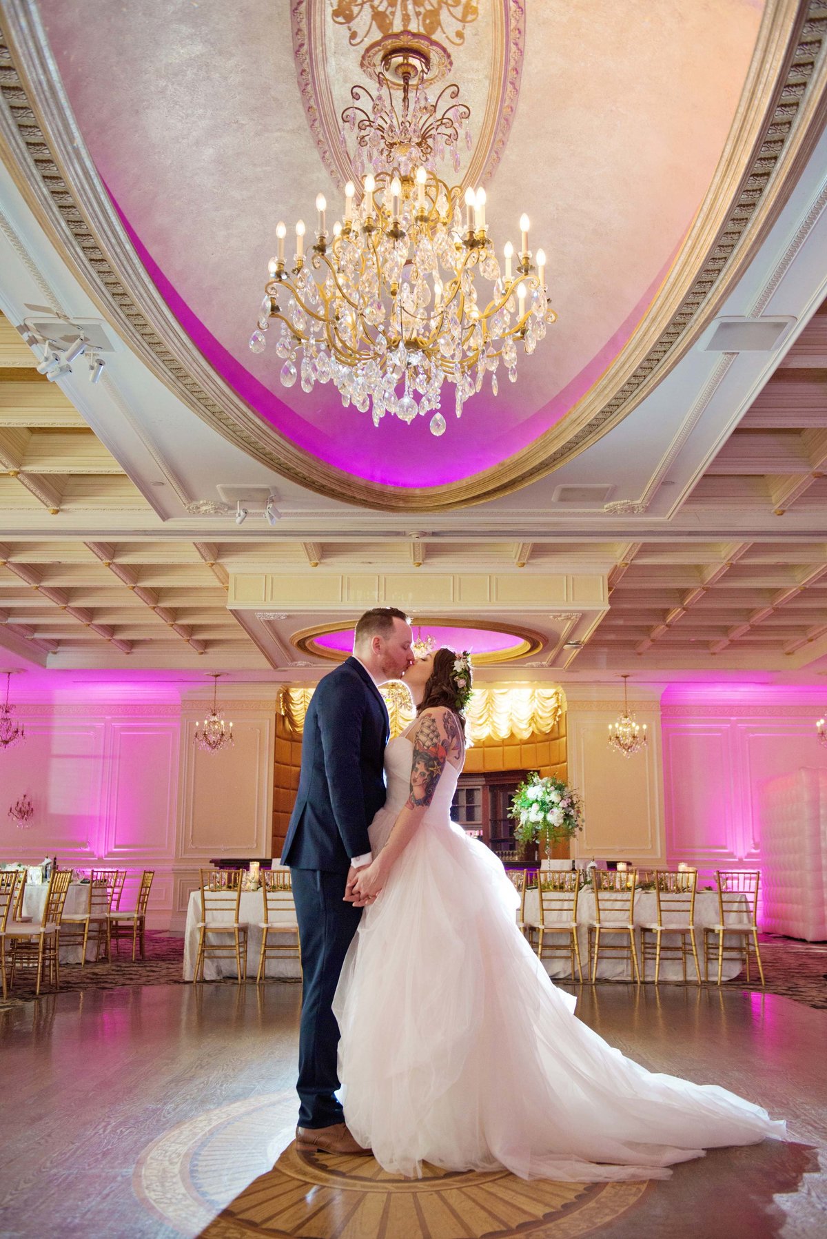 Bride and groom kissing at The Inn at New Hyde Park