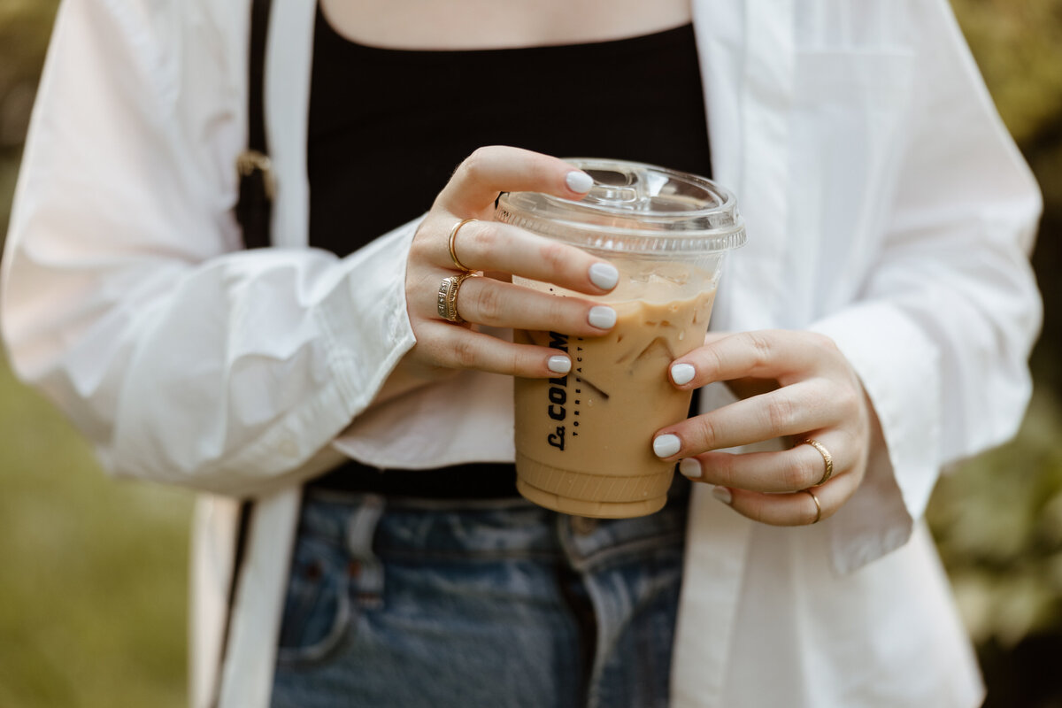 Up close picture of Lydon holding a coffee cup