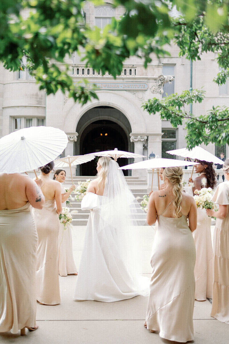 Bridal party holding umbrellas by best wedding planners in chicago