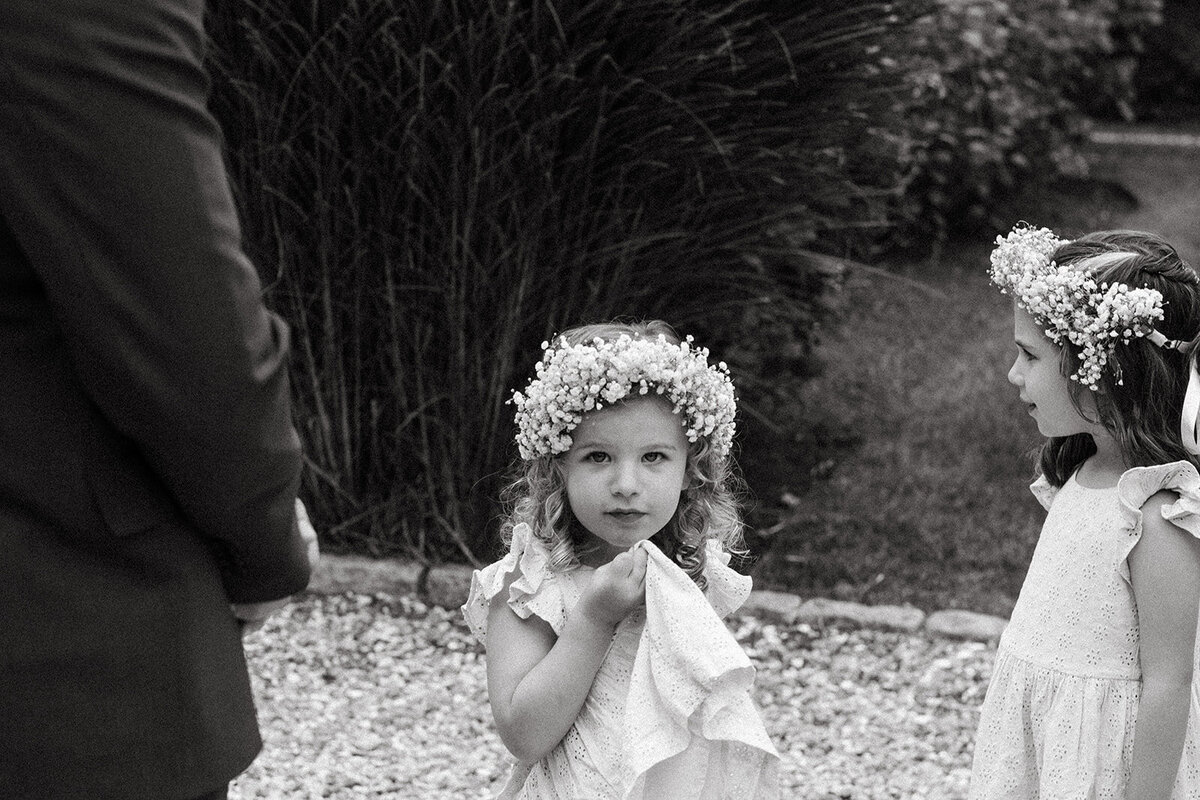 Documentary-style wedding photography of flower girl in Cape Cod