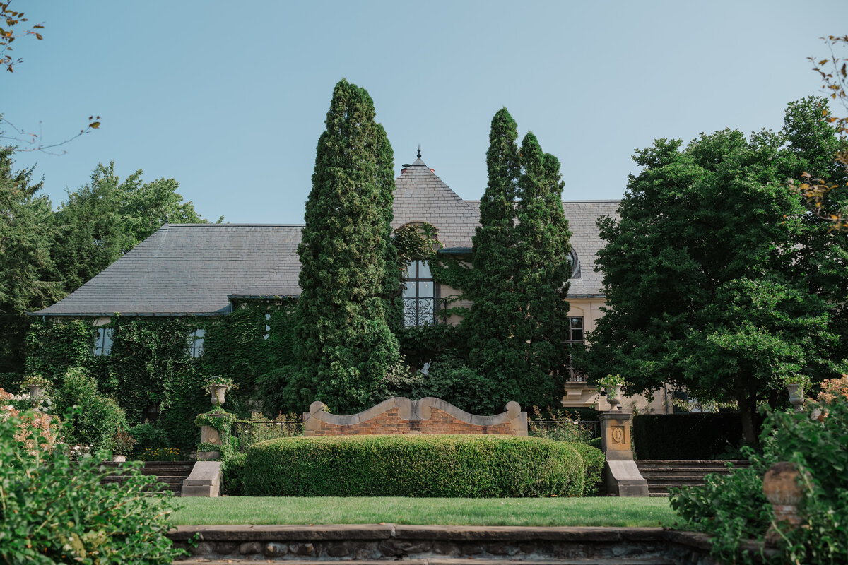The backyard of a luxury wedding venue Greencrest Manor with gardens