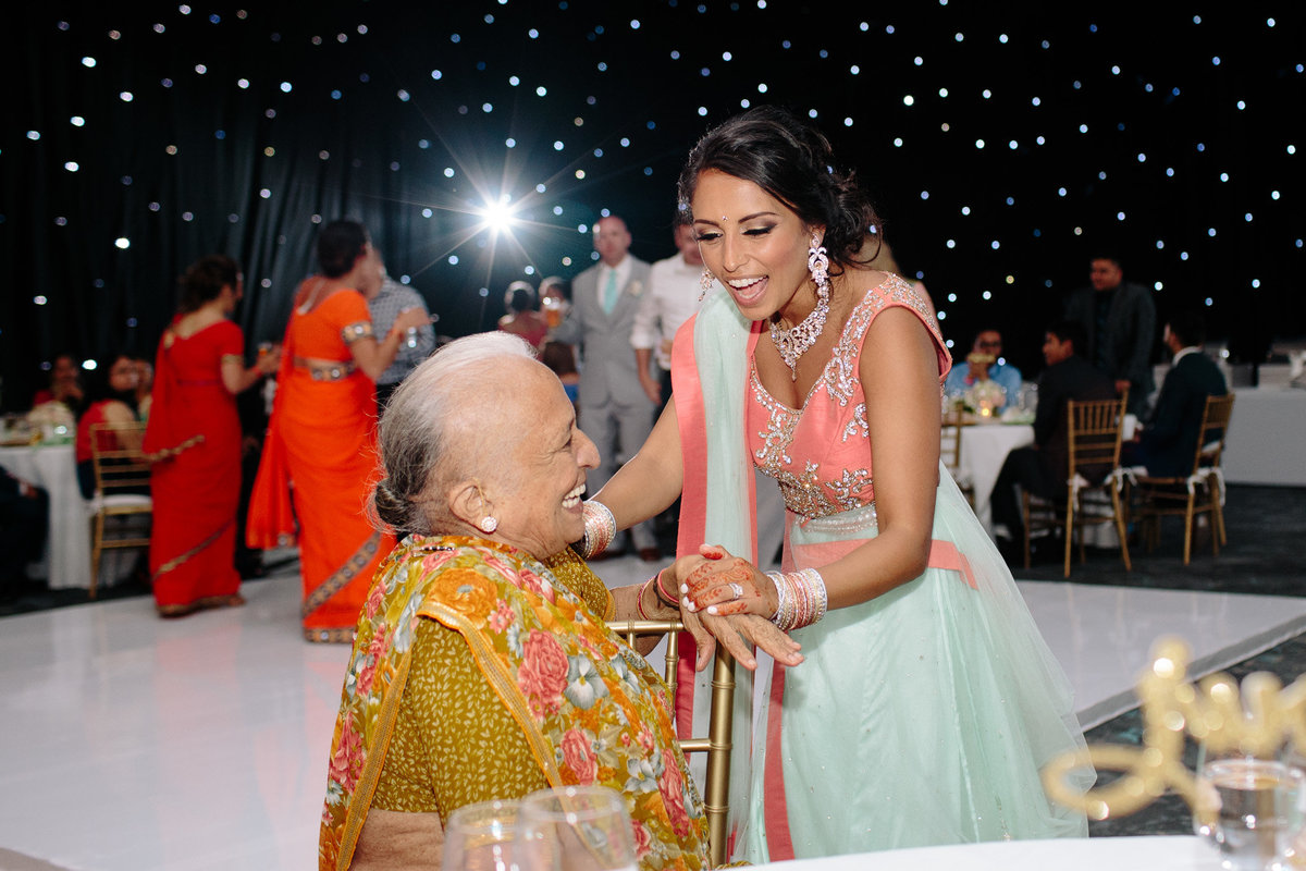 Candid emotion between a bride and her grandmother.  Authentic moment captured by Rebecca Cerasani