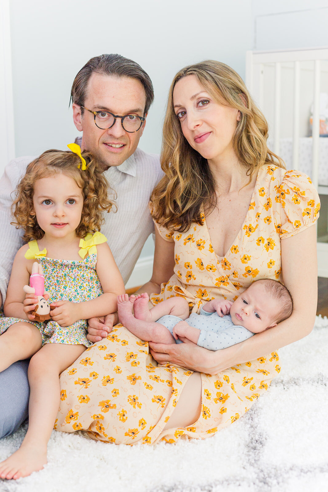 family with newborn in nursery | by Atlanta lifestyle newborn photographer Laure Photography