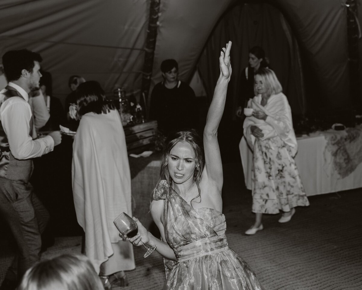 Friends and family dancing at their daughters wedding in Manorbier castle