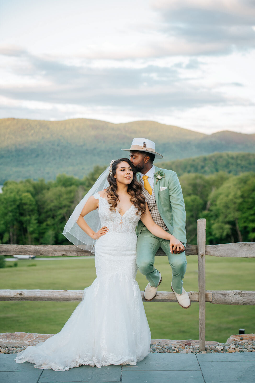 stylish bride and groom with mountain landscape at chittenden vermont wedding mountain top inn and resort