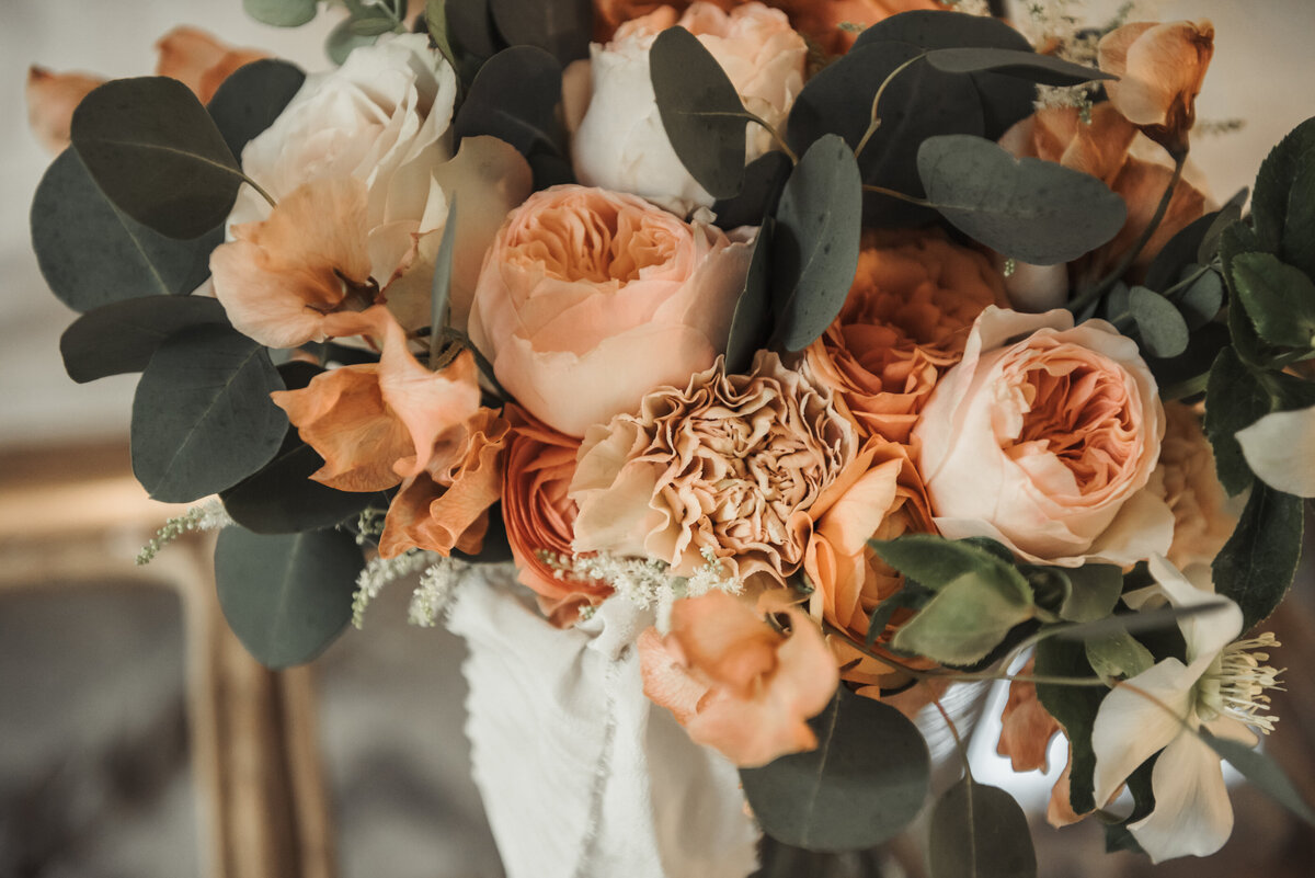 Orange peach and ivory bridal bouquet