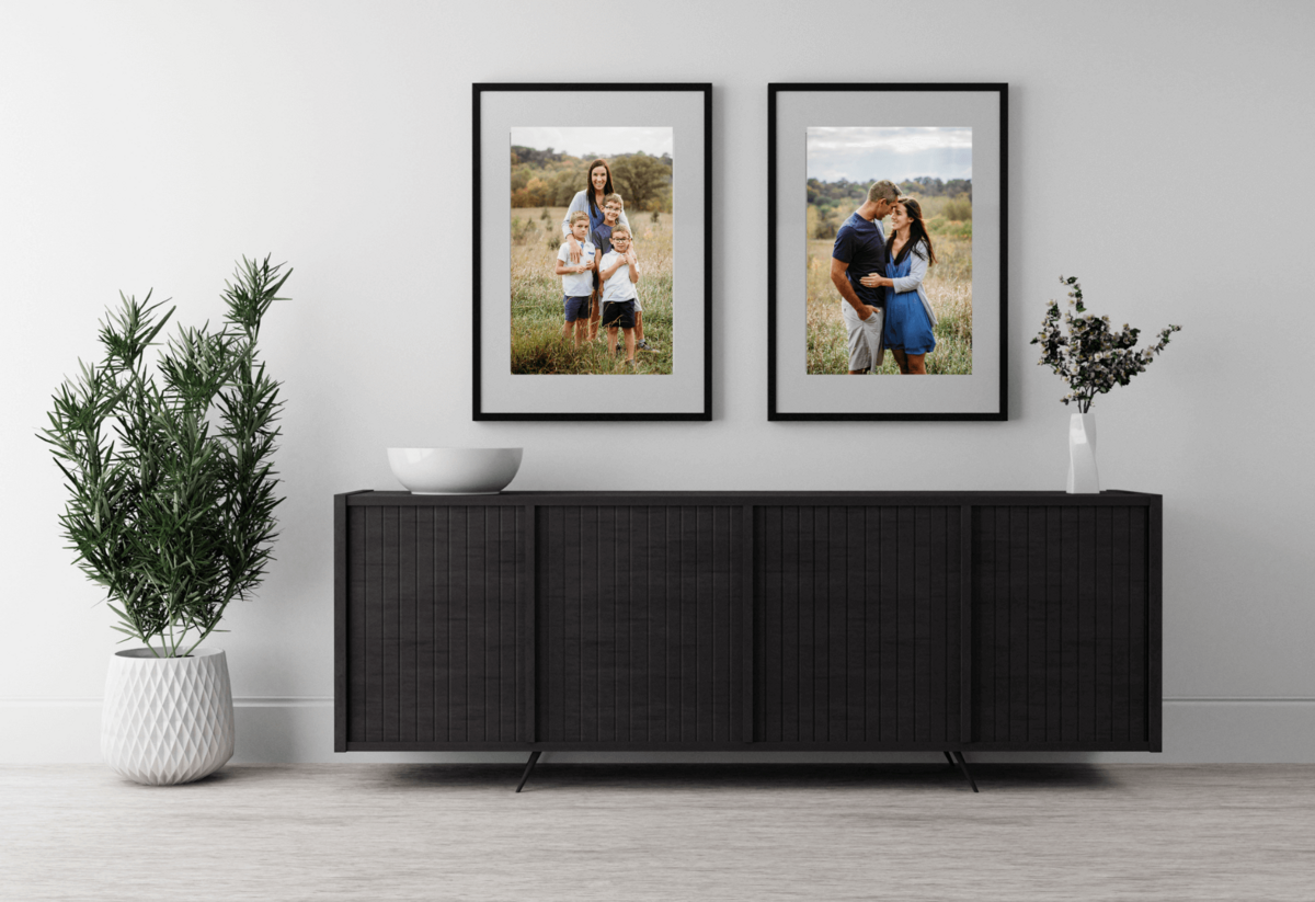Family portraits framed in entry way.