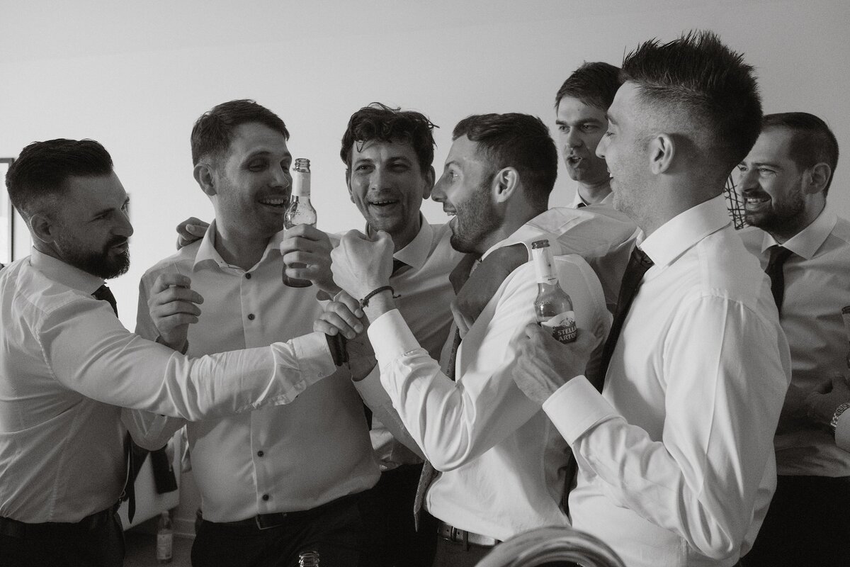 the boys shaking and exciting the groom in the morning