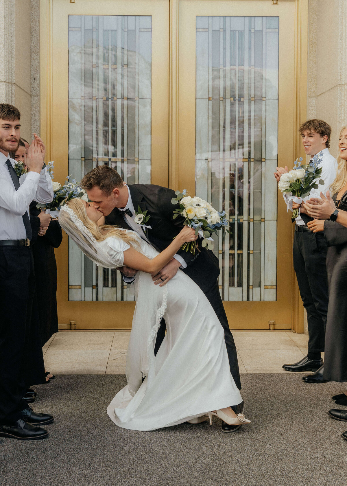 jmay-photo-wedding-kiss-celebration-utah-temple