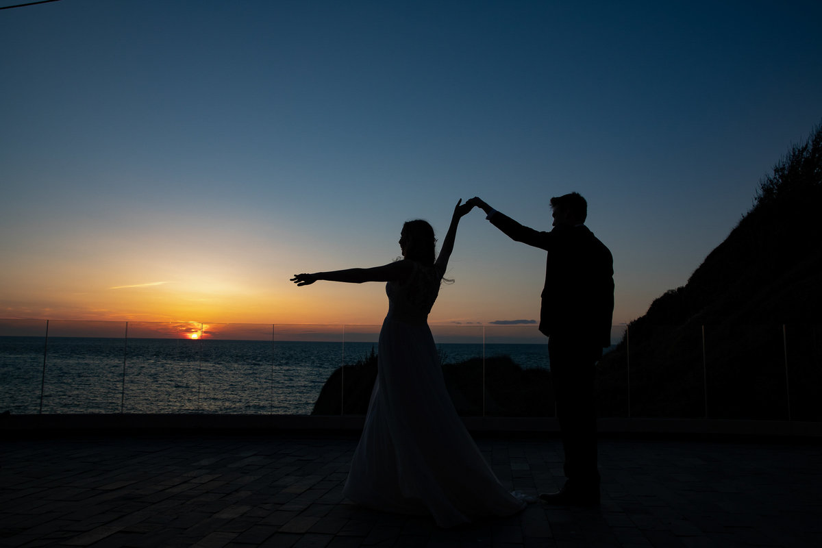 Dancing on the roof terrace at sunset at Tunnels Beaches North Devon Wedding Venue