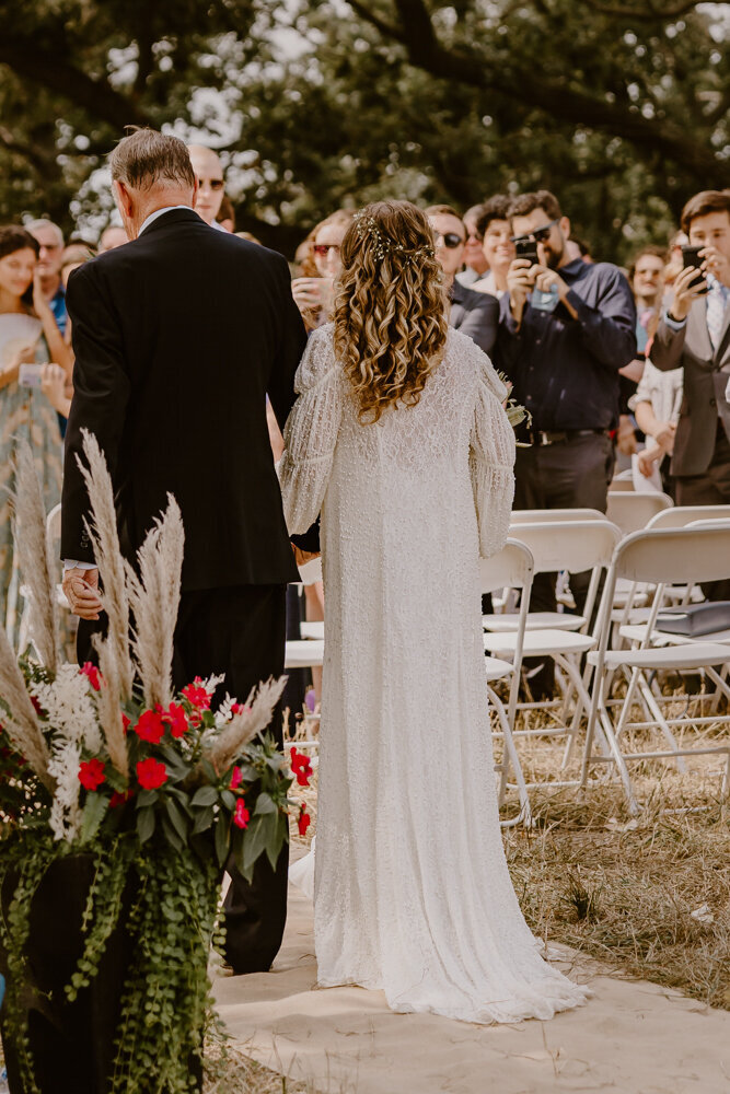 wedding-ceremony-dad-walking-bride-down-aisle-des-moines-wedding-photographer-storyteller-collective-photo-co