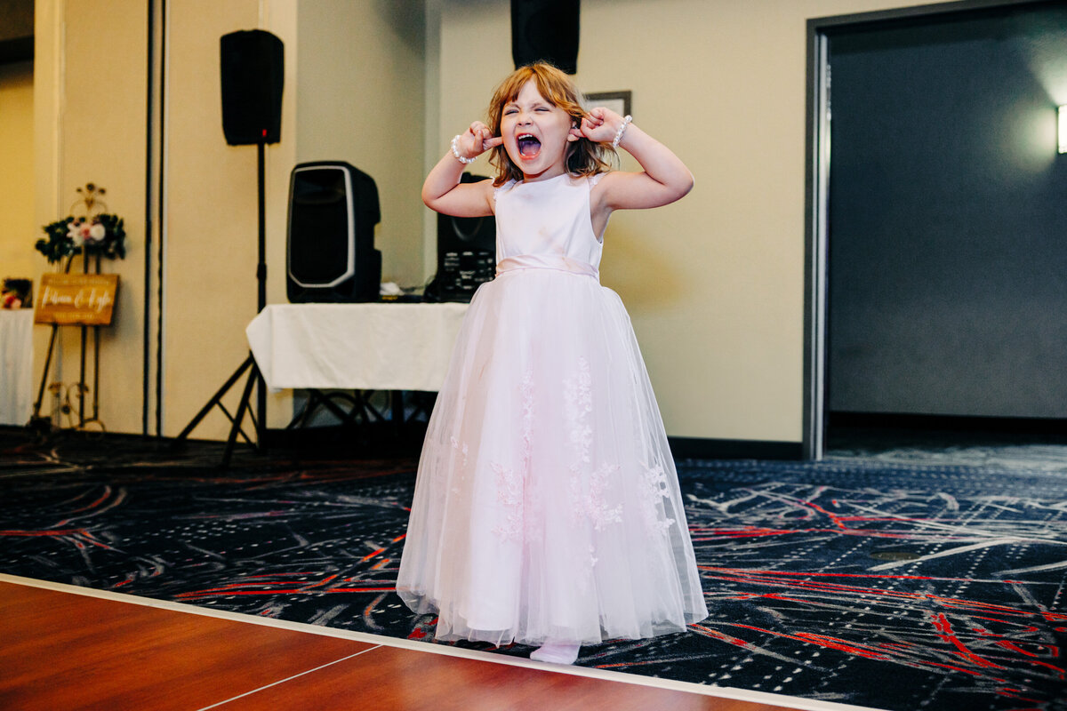 Flower girl plugging ears and screaming due to loud music at Kwataqnuk Resort