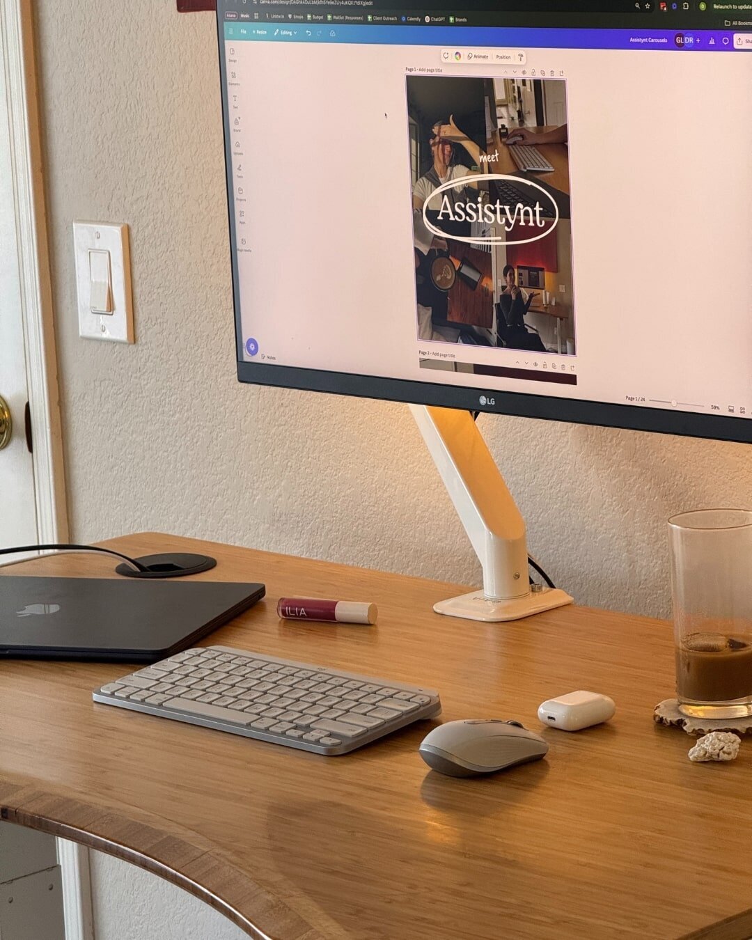 desk monitor from a content creator virtual assistant next to a glass full of coffee