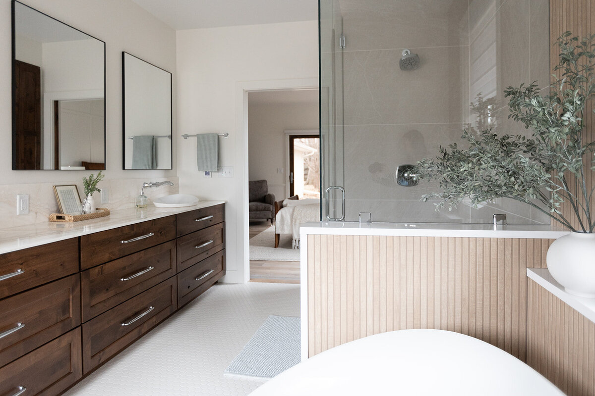 michele rosenboom design clean country renovation bathroom dark wood vanity and glass door shower