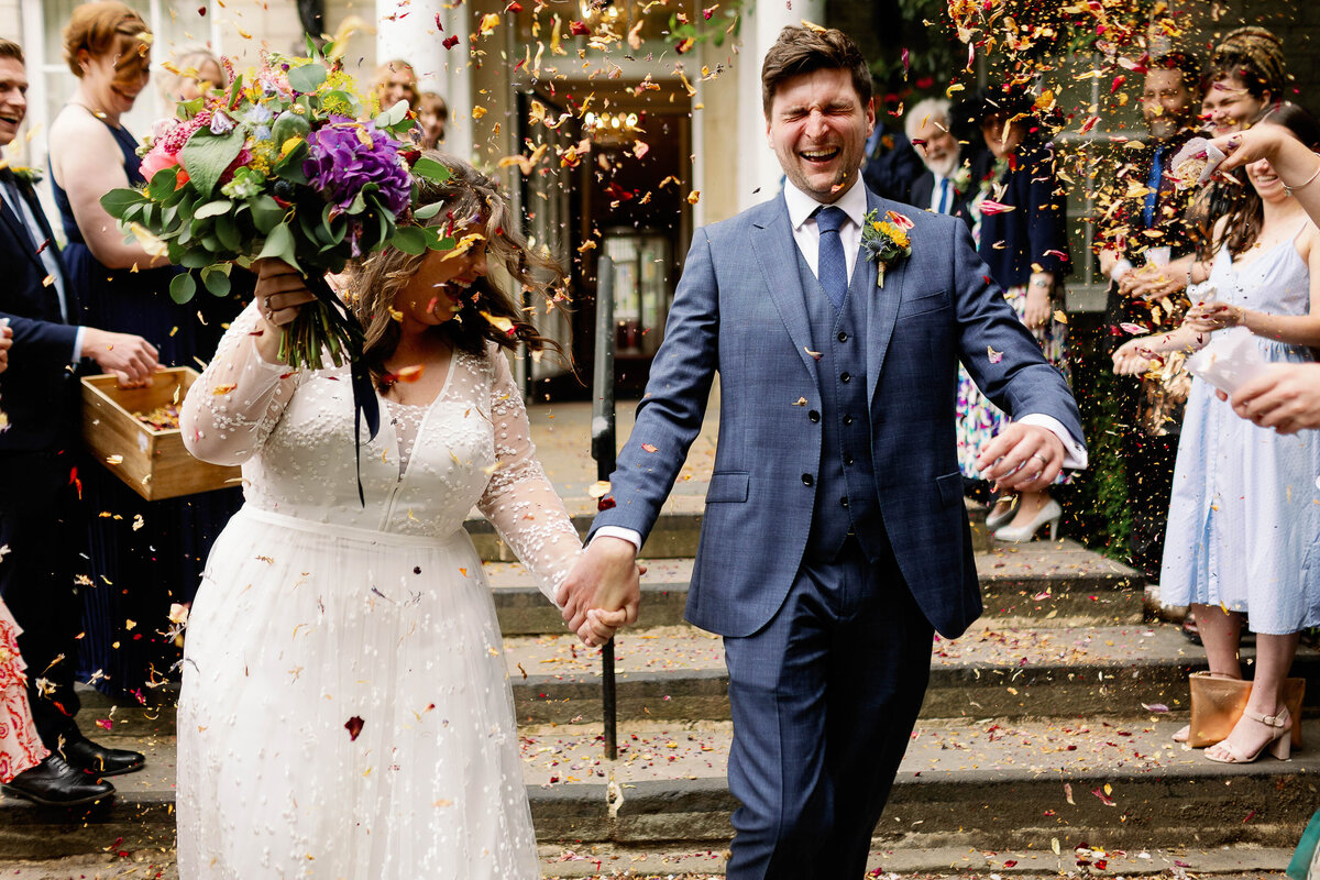 Couple being drenched in confetti outside Harrogate Registry Office