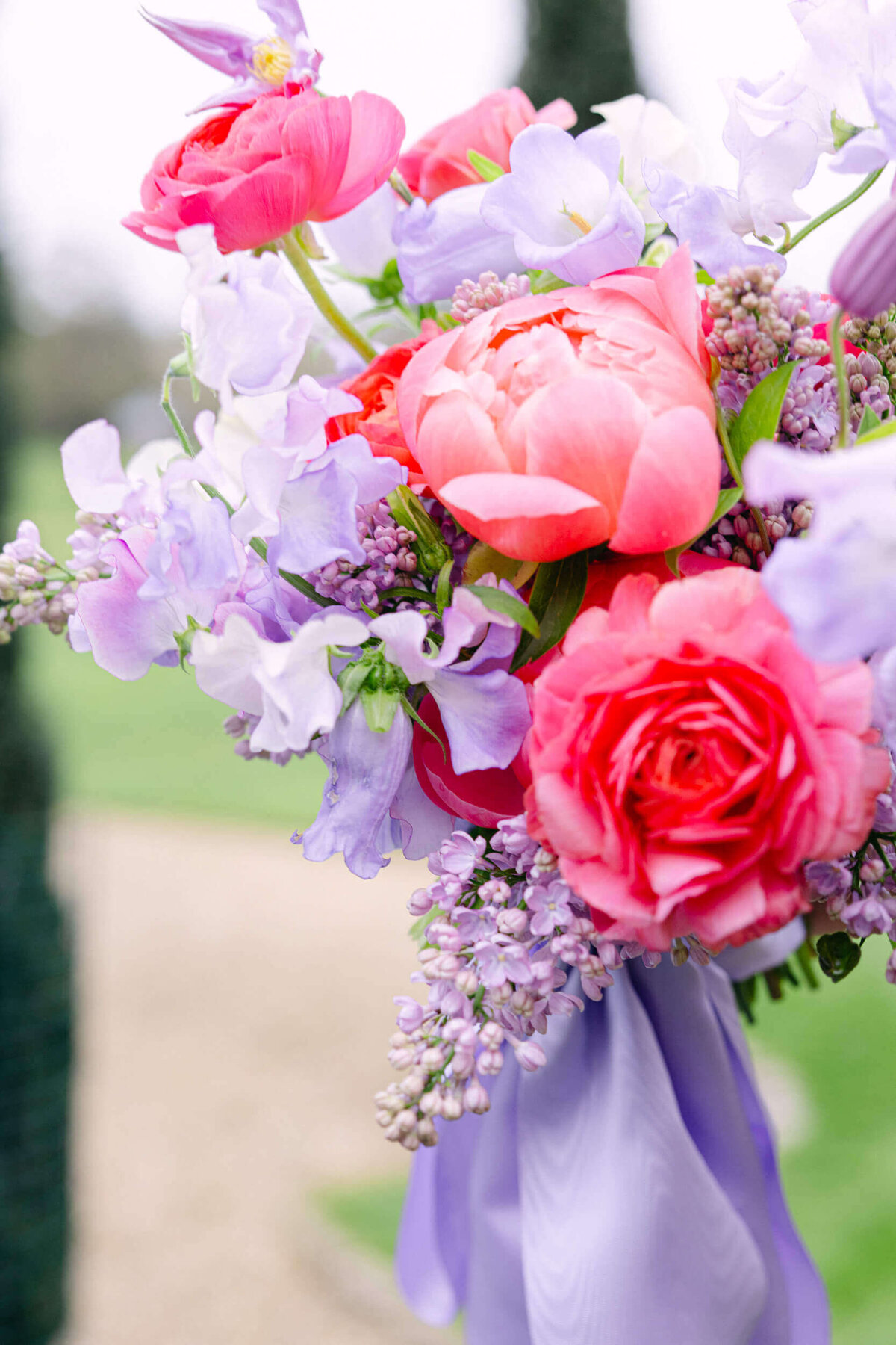 A wedding photo of the brides purple bouquet