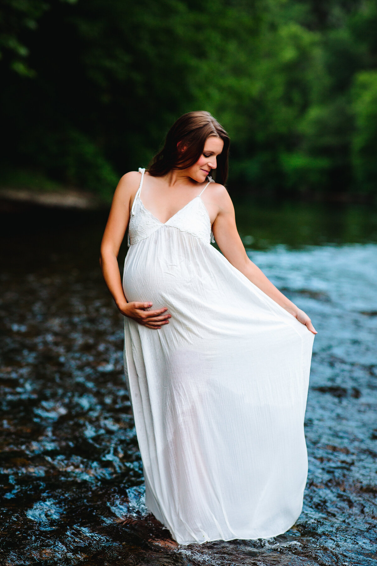 pregnant woman in a river maternity photoshoot