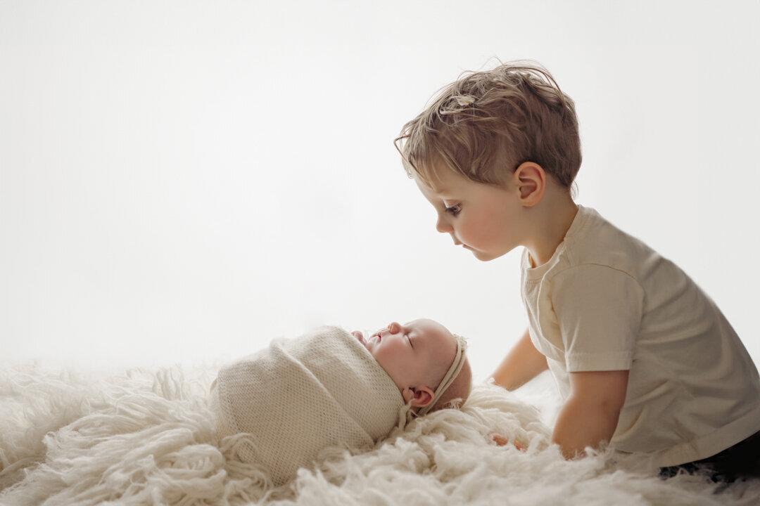 Grand Rapids Newborn Photography Big Brother Looking at Baby  by For the Love of Photography