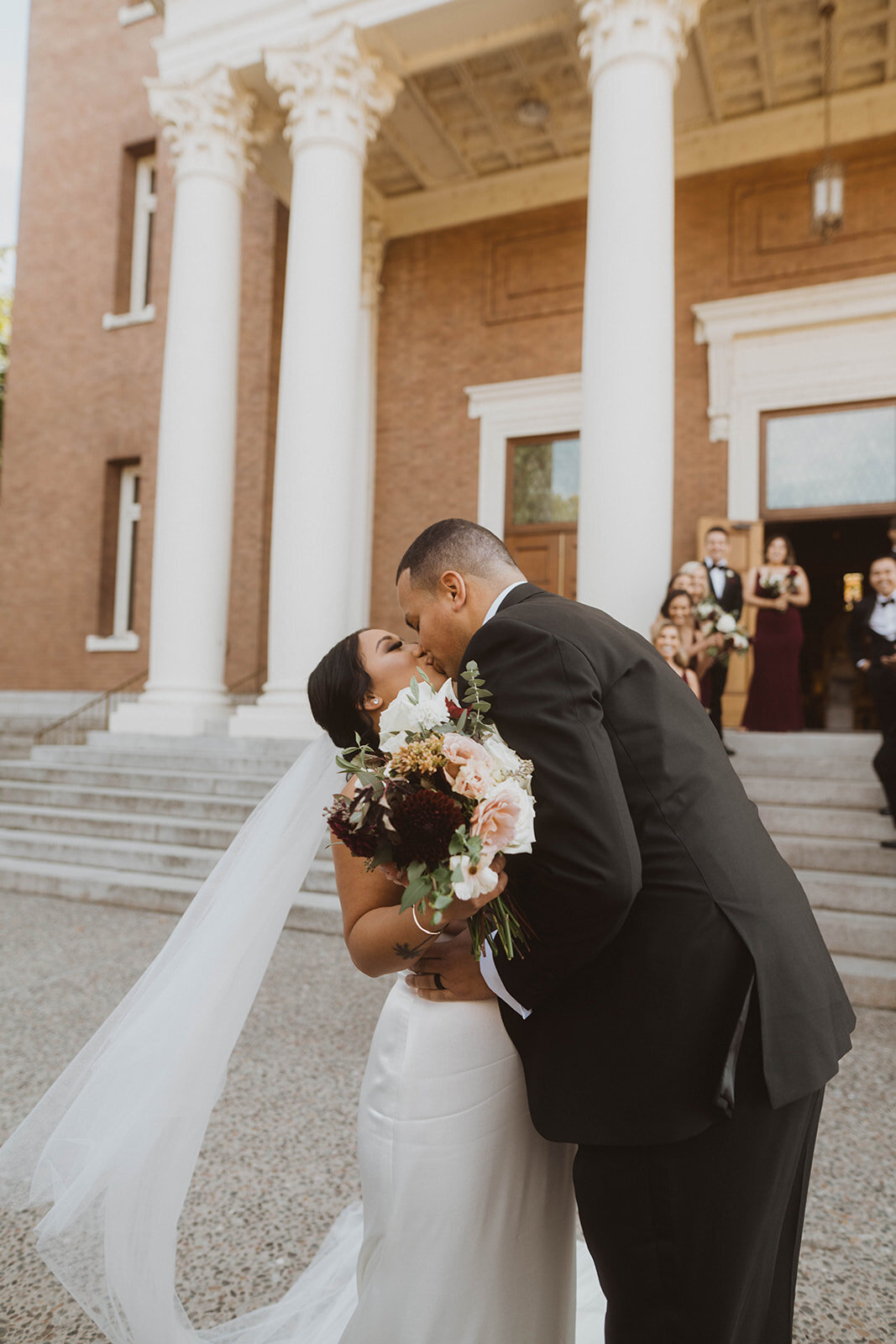newlywed kiss at st. aloysius church at gonzaga university
