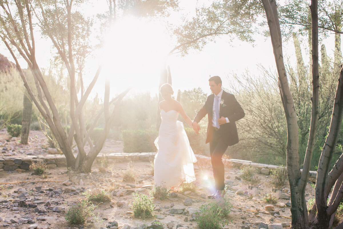 A moody and mysterious black and white bridal boudoir photo captured in a window.