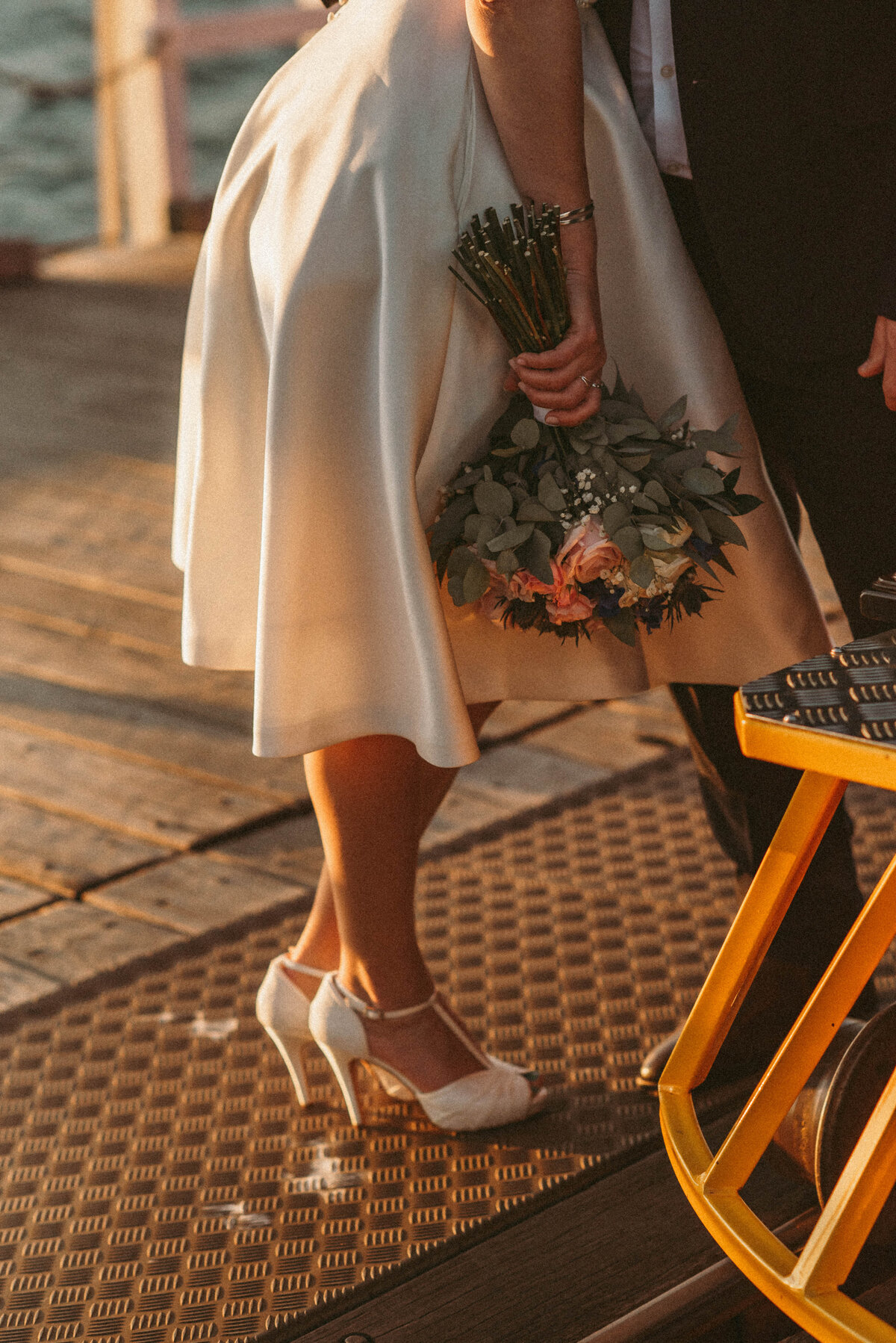Bride and groom small wedding at Busselton Jetty photographed with the train captured by south west and Perth photographer Kalie Creative