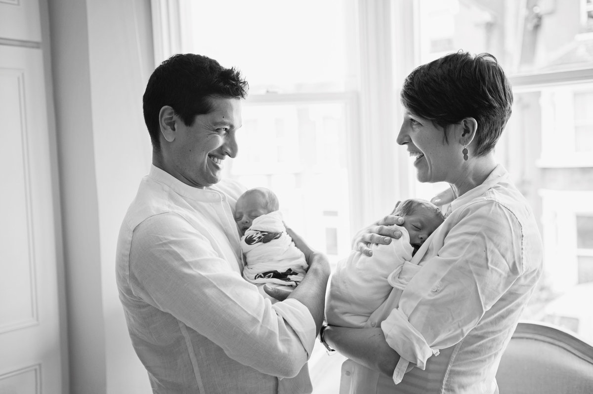 Newborn twin photography with parents