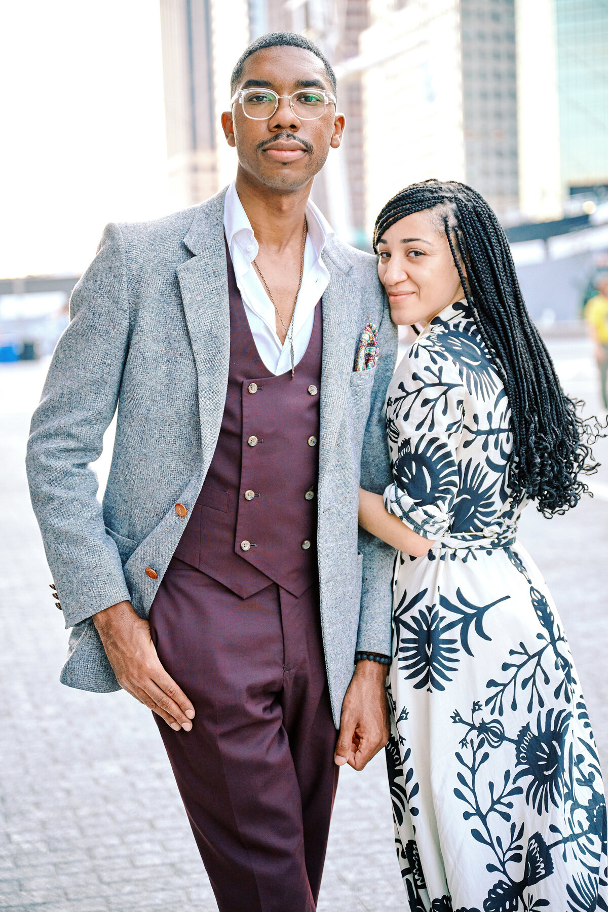 Couple stand linked together after a Rooftop Proposal in NYC.  Proposal Photographer Corey Lamar Photography