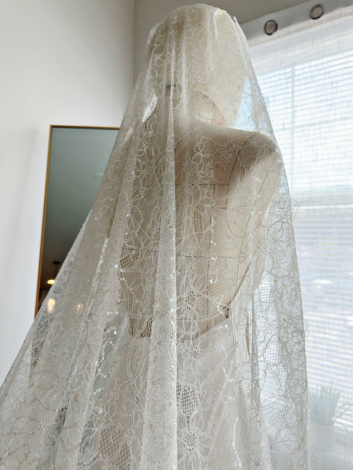 Classic Spanish-style mantilla veil with intricate floral lace trim
