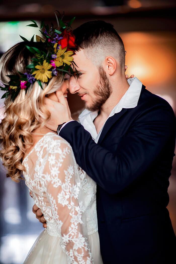 groom-grabs-brides-face-smiles