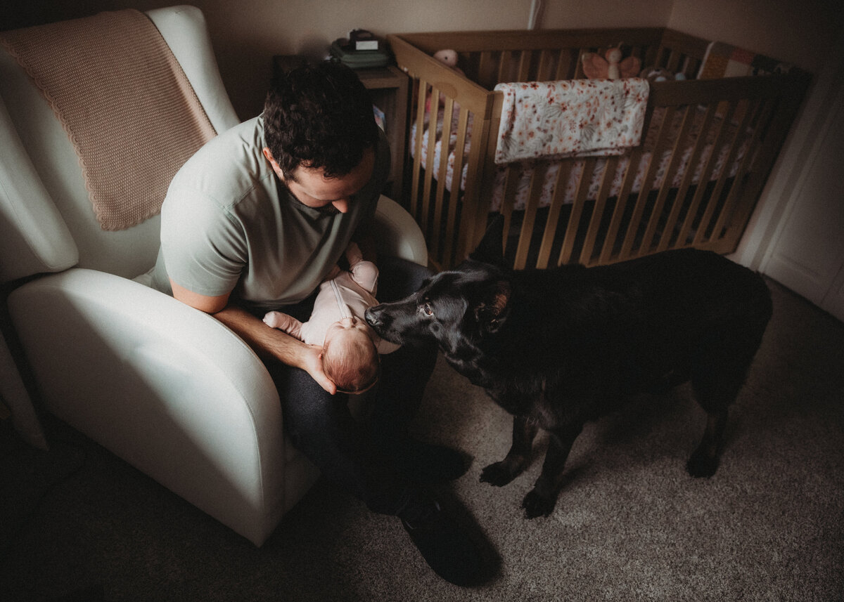 newborn and puppy