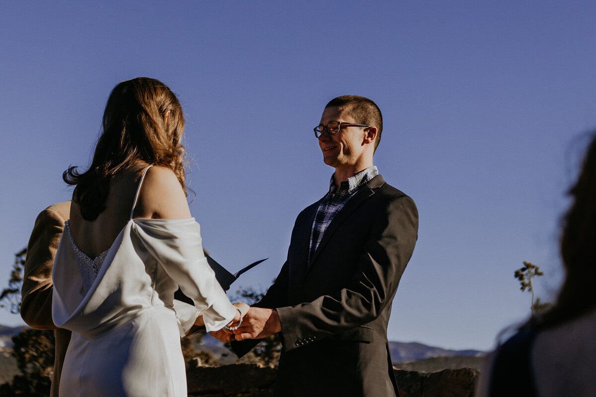 bride and groom having their ceremony in their backyard in Santa Fe, New Mexico