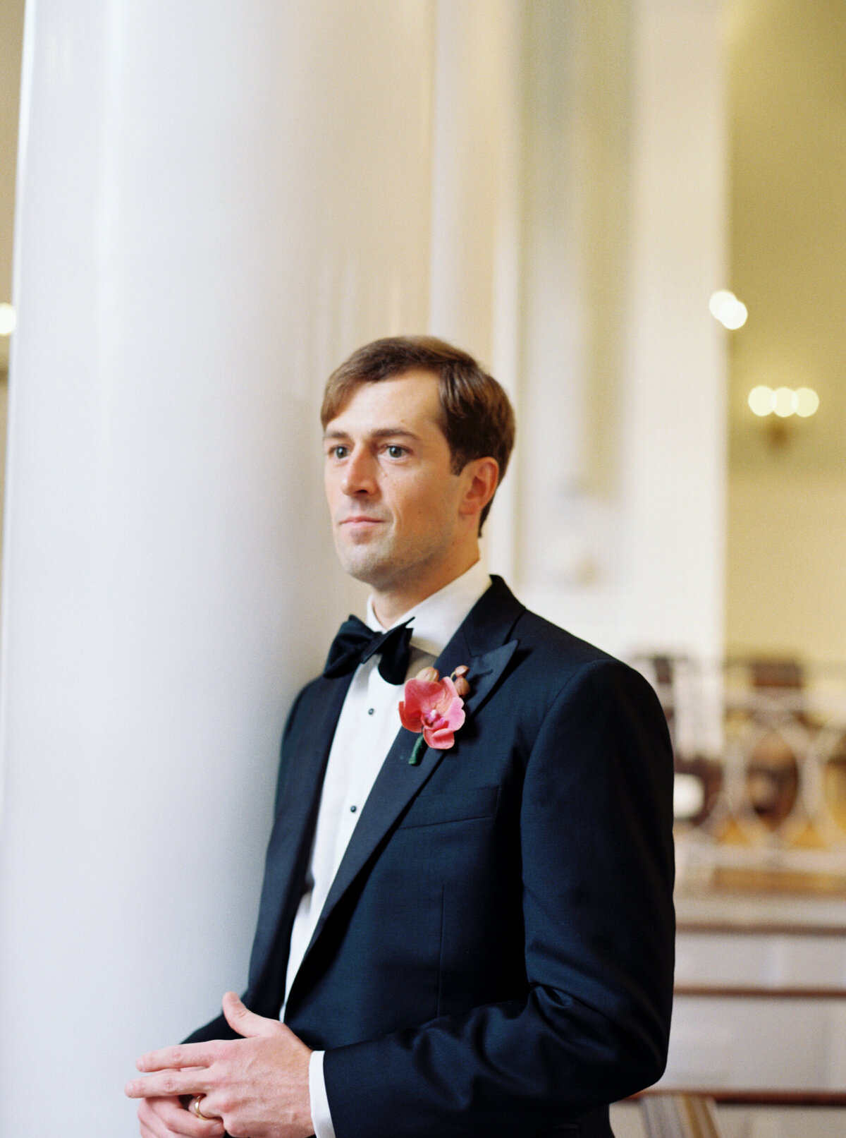A wedding day portrait photo of the groom before his ceremony