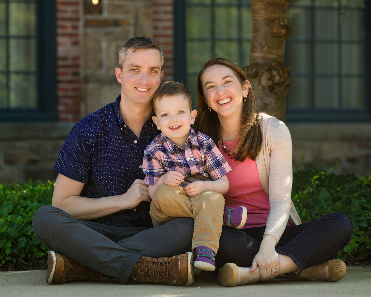 A close-knit family enjoying natural moments together during a spring mini session at scenic Phoenixville Foundry.