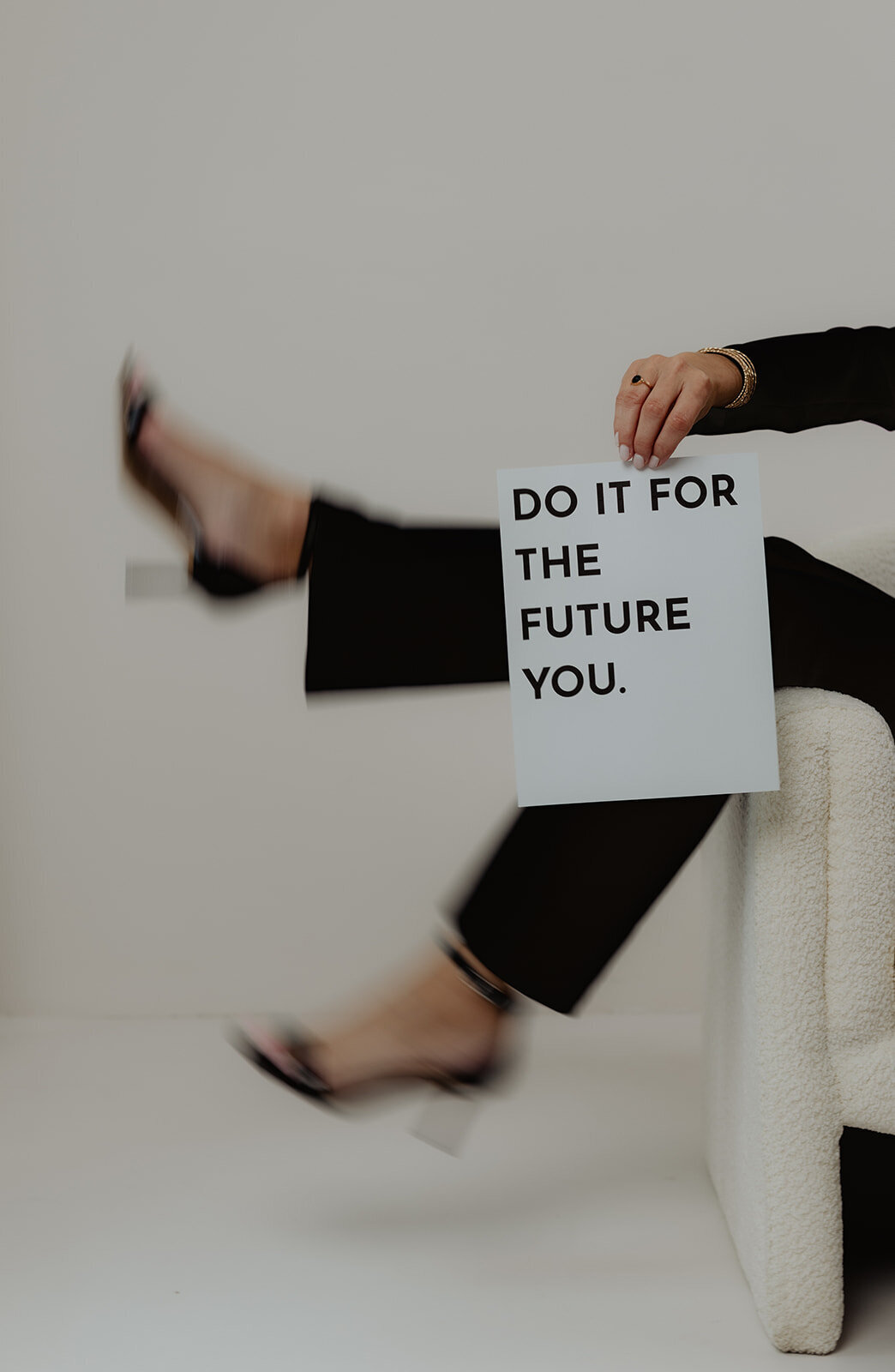 creative branding portrait of legs with a sign