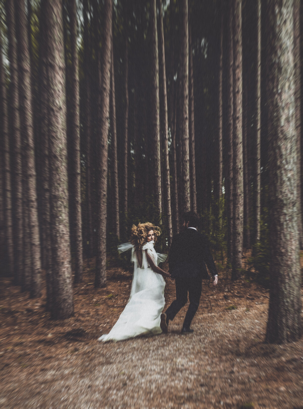 Foresty bride and groom candid photo at Pinewood, MN - https://methodandmatte.com/