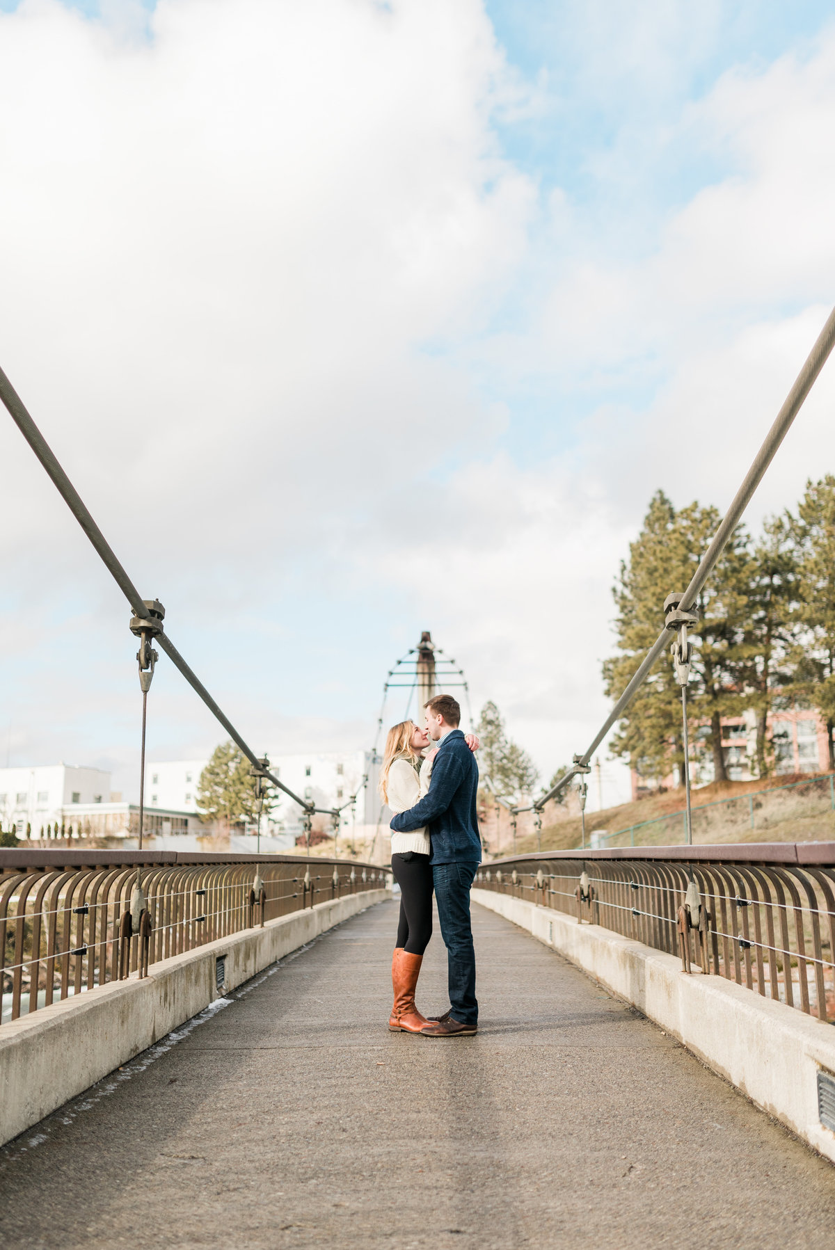 couple on the bridge at river front park