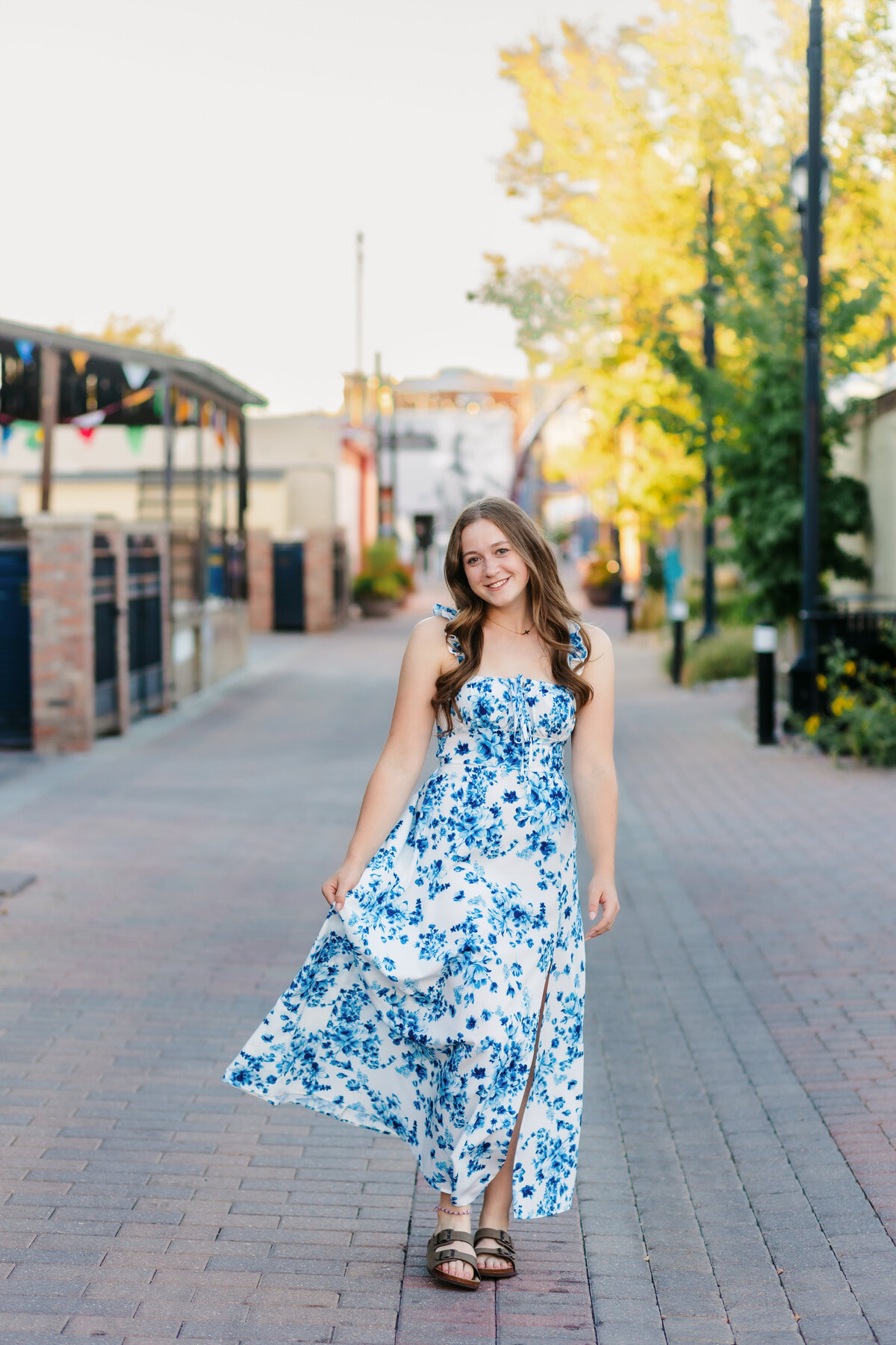 A Fort Collins High School senior walks in Old Town, Fort Collins.