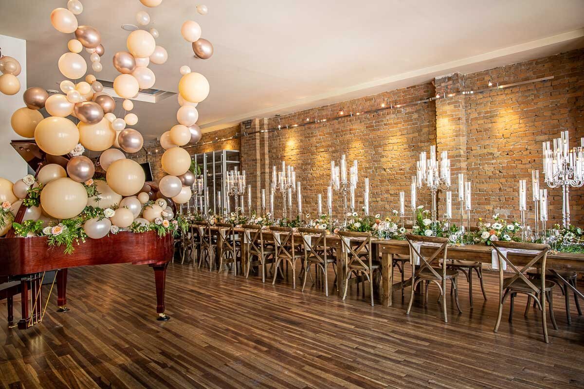 Elegant indoor wedding reception at The Garret, historical and sophisticated, Calgary, Alberta wedding venue, featured on the Brontë Bride Vendor Guide.