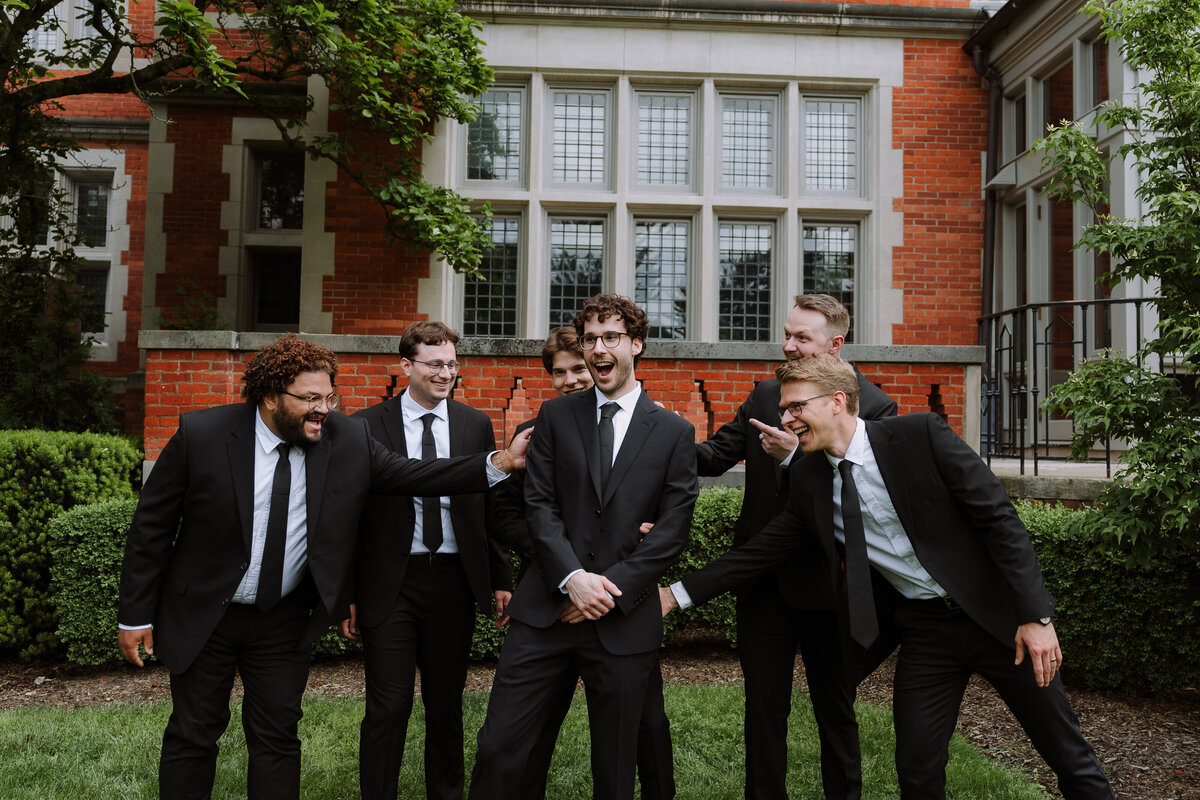 groomsmen sharing a special moment