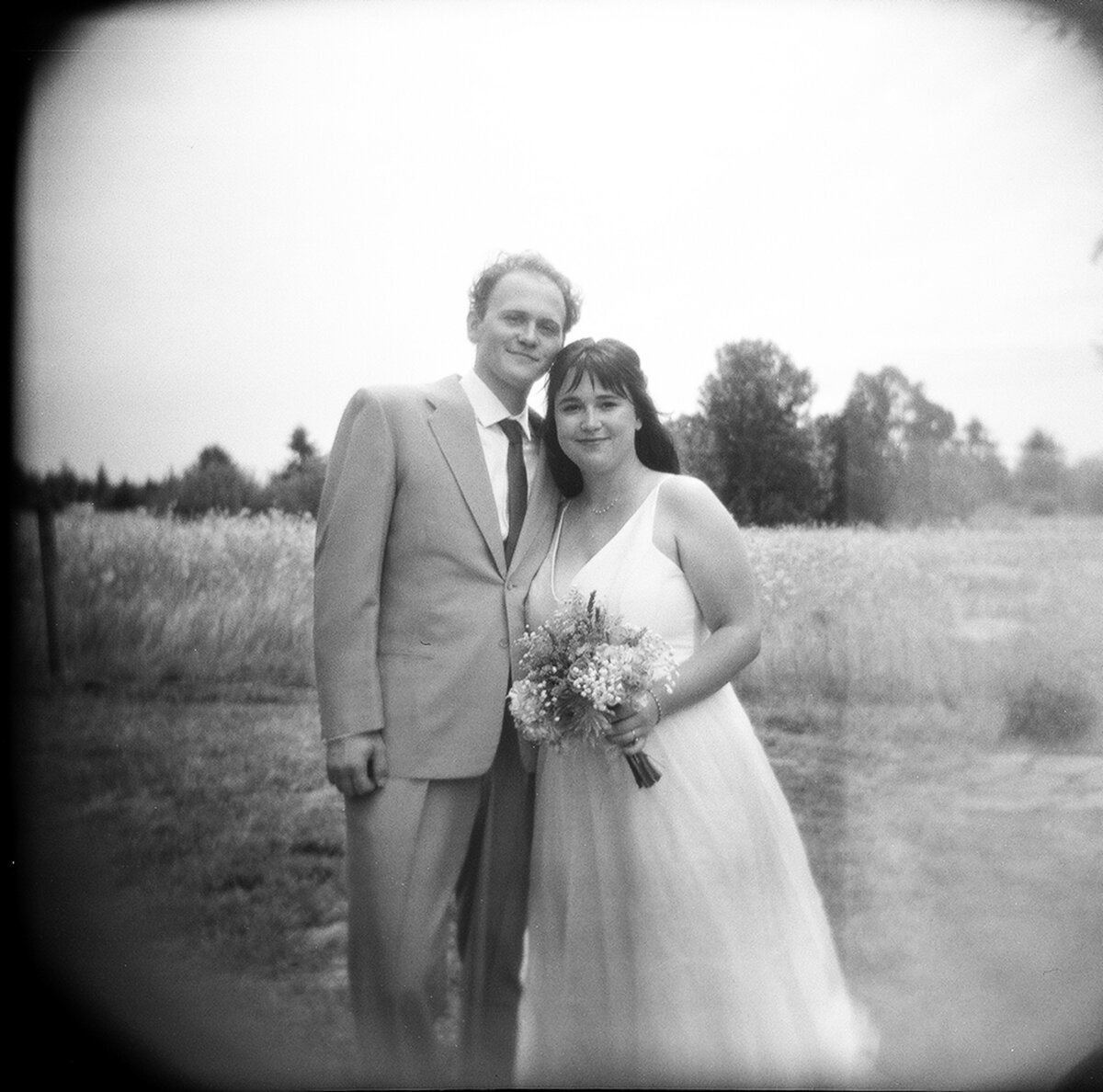 Black and white Holga portrait of bride and groom on their wedding day.