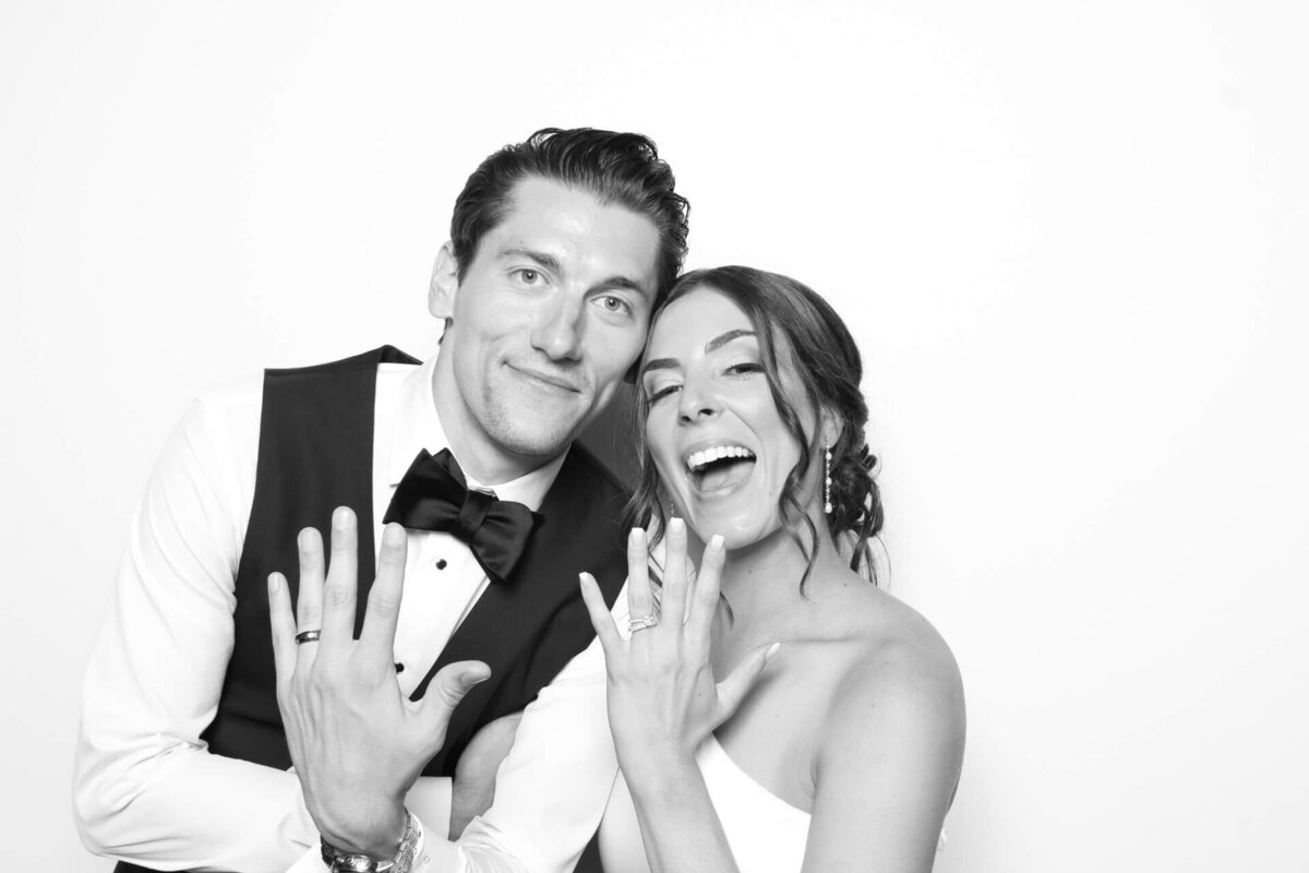 bride+and+groom+pose+shot+on+black+white+photo+booth