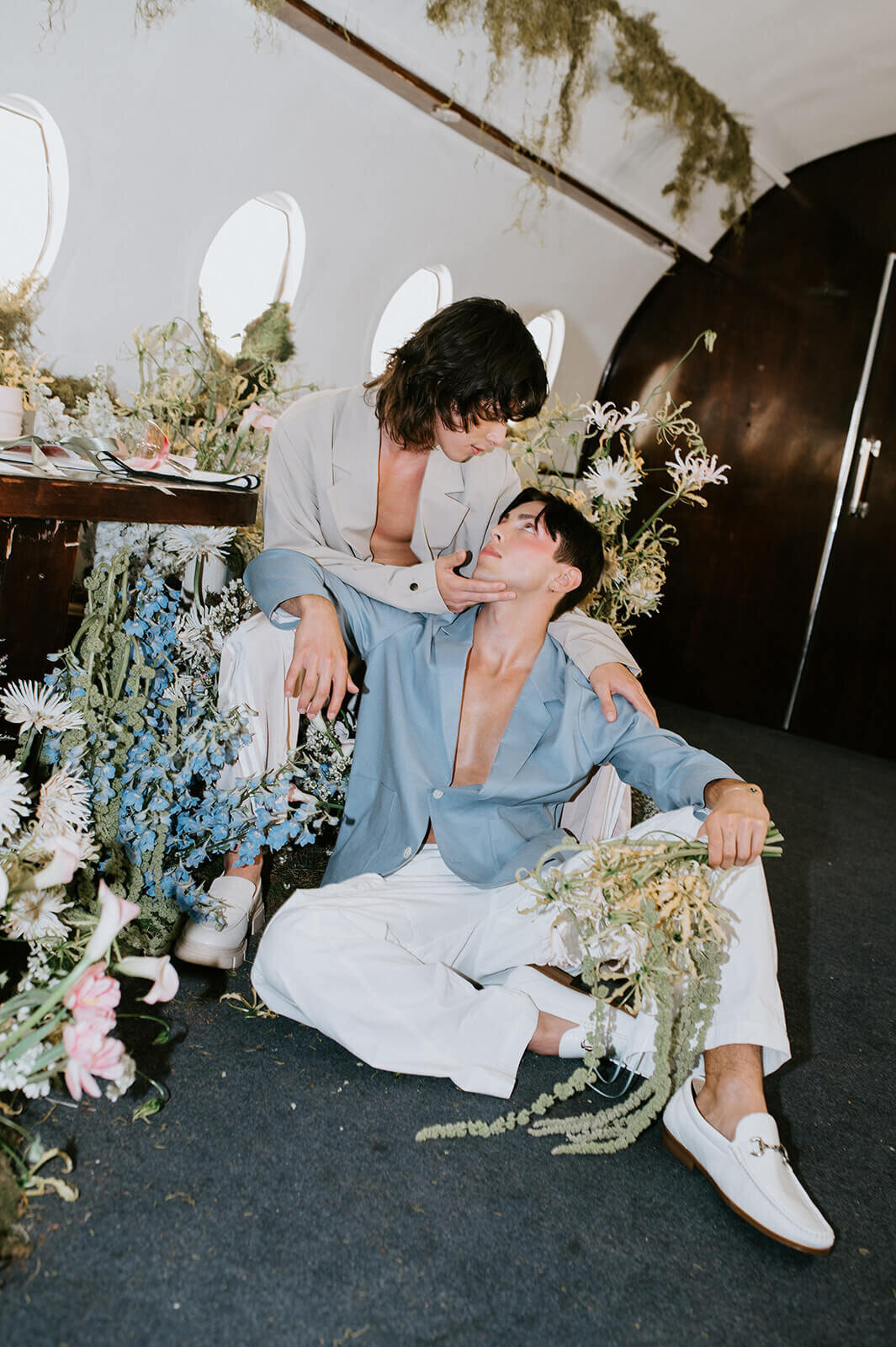 Grooms-beside-flowers