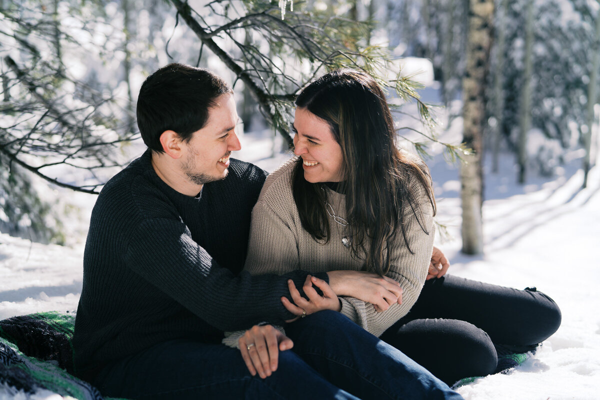 engaged-couple-flagstaff-blanket-snow