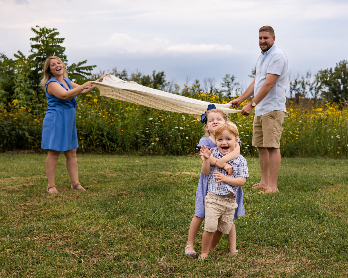Family playing with a Blanket