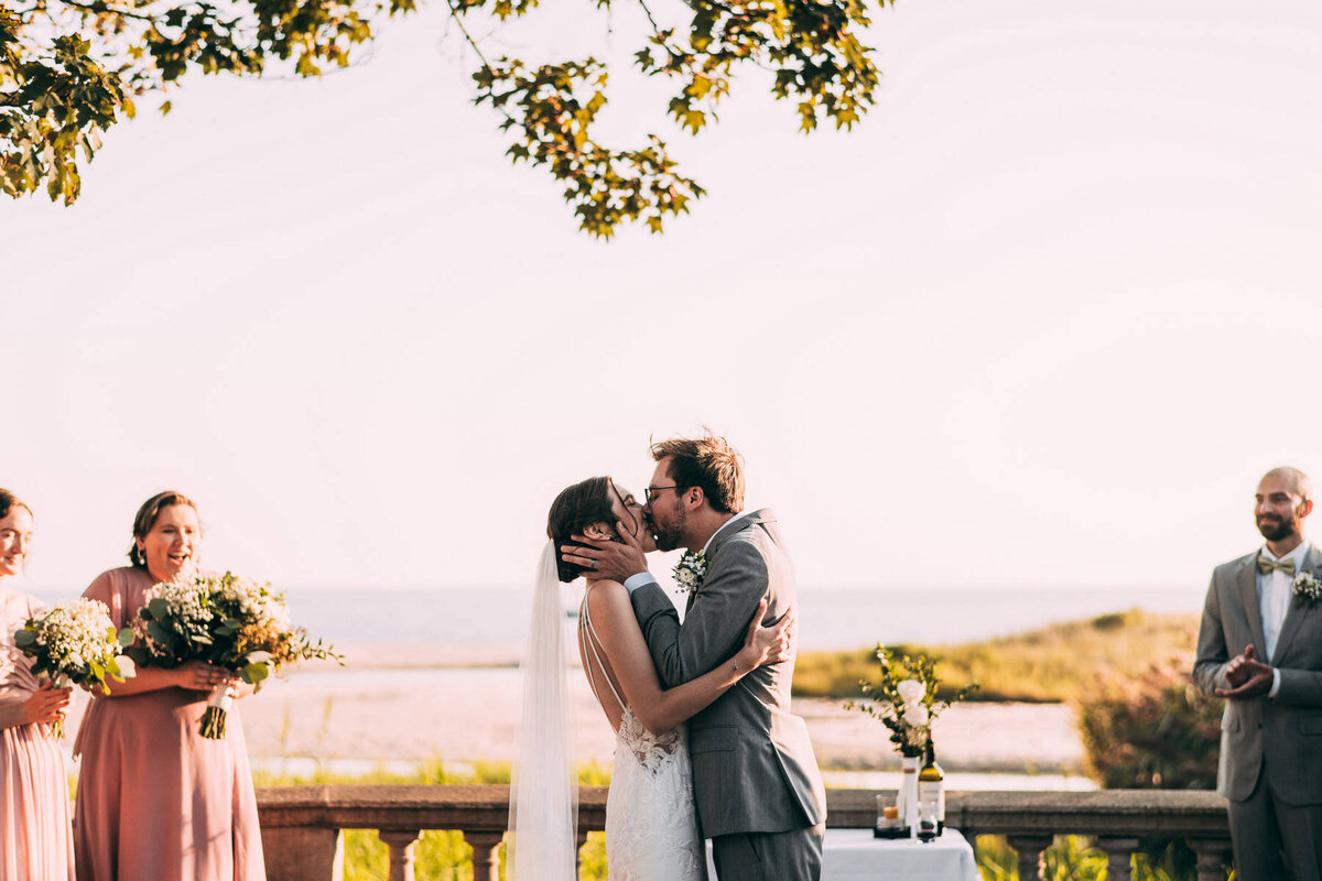 ct-beach-mansion-wedding-first-kiss-bride-and-groom