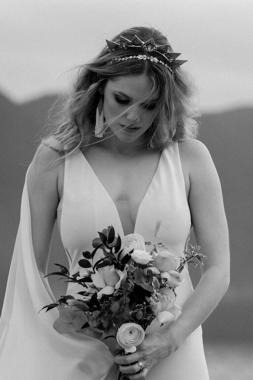 bride looking at bouquet