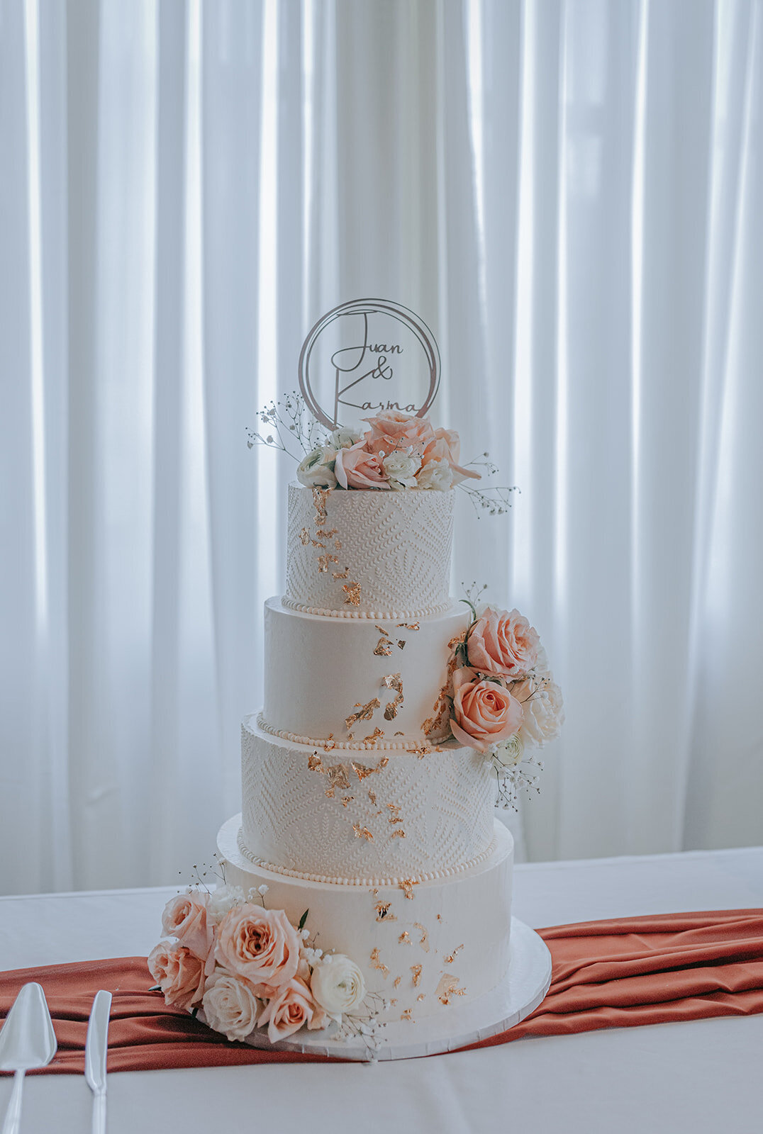Four tired wedding cake design with pink flowers