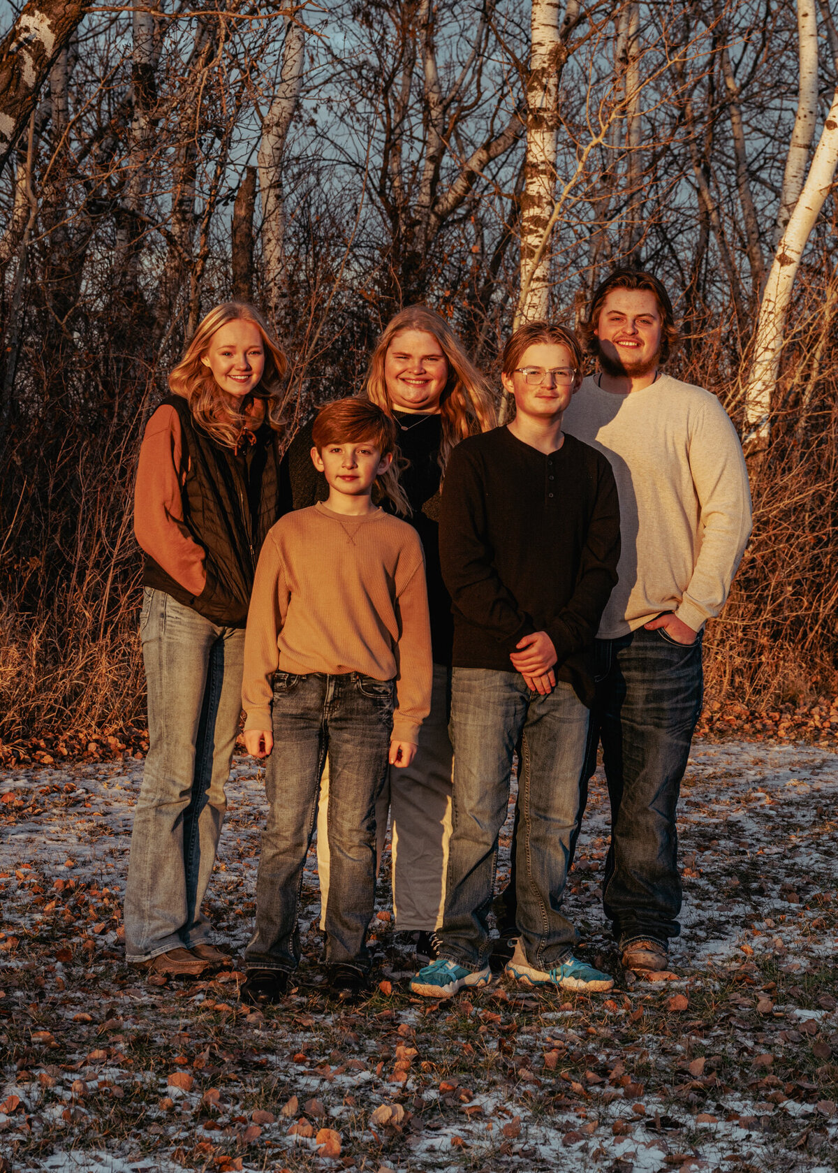 siblings standing together smiling